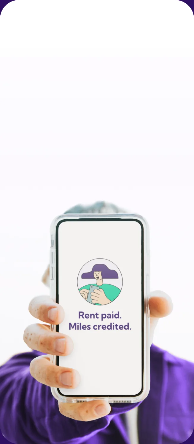 Person holding up a phone showing rent paid, miles credited